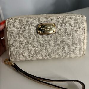 Michael Kors wallet in classic brown and white leather.
